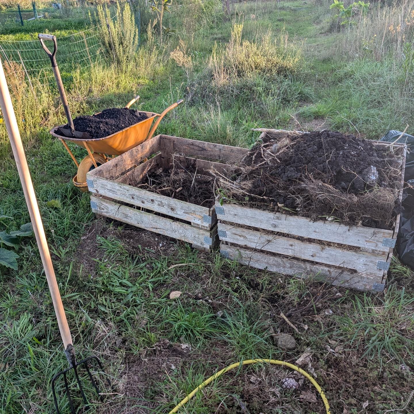 Turning the compost and mixing in biochar