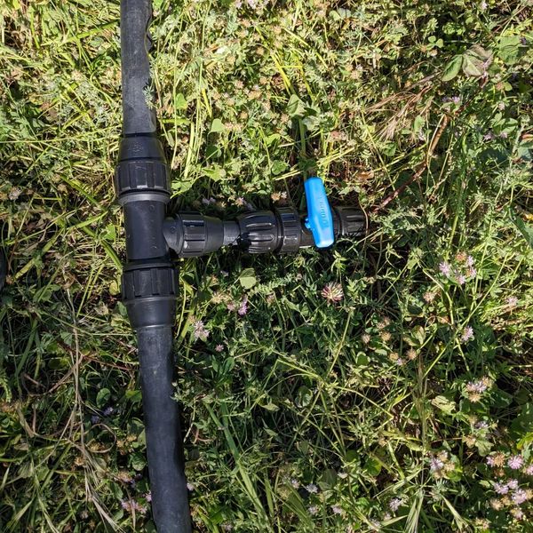 Installing a bunch of hose fittings to prepare for 2 #irrigation lines (one of them now functional on the west #swale #berm), a couple of soaker hoses, and a water point