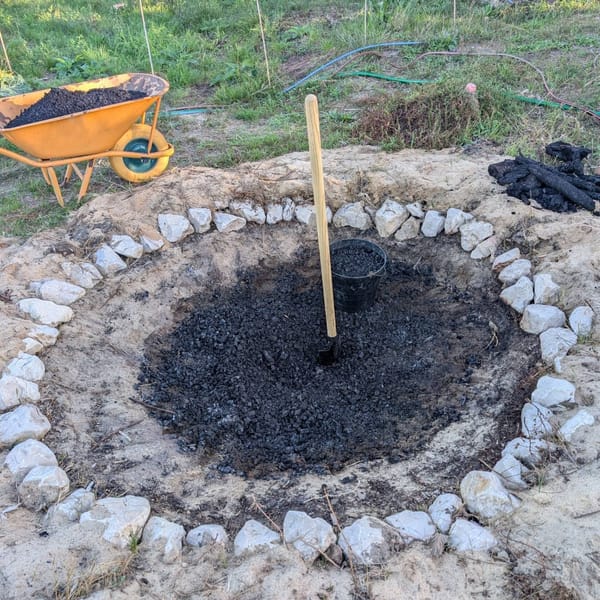 Crushing and hauling biochar out of the pit