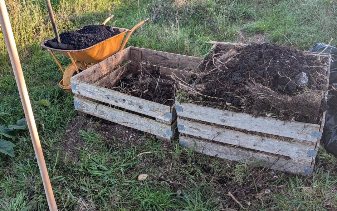 Turning the compost and mixing in biochar.