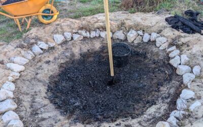 Crushing and hauling biochar out of the pit.