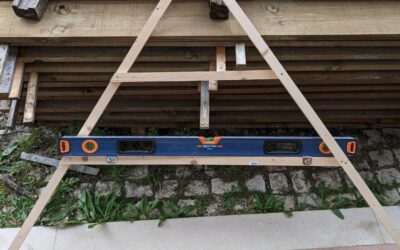 Made an A-frame level and used it to mark the location of a mini swale on top of the playground.