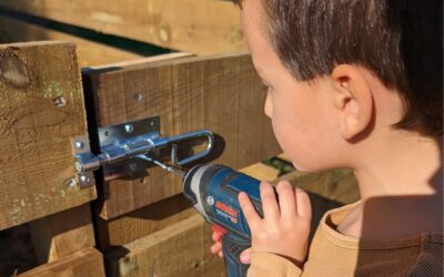 Installing latches on the nursery gates.