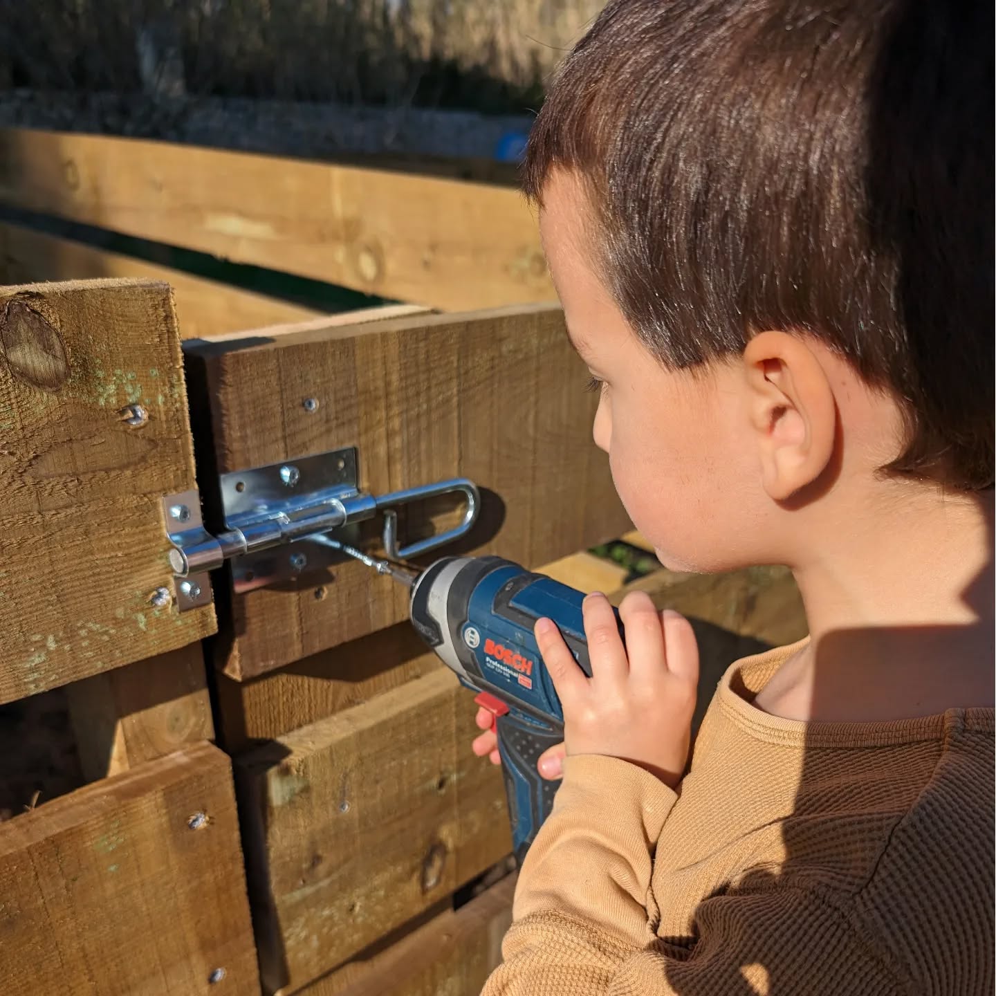 Installing latches on the nursery gates.