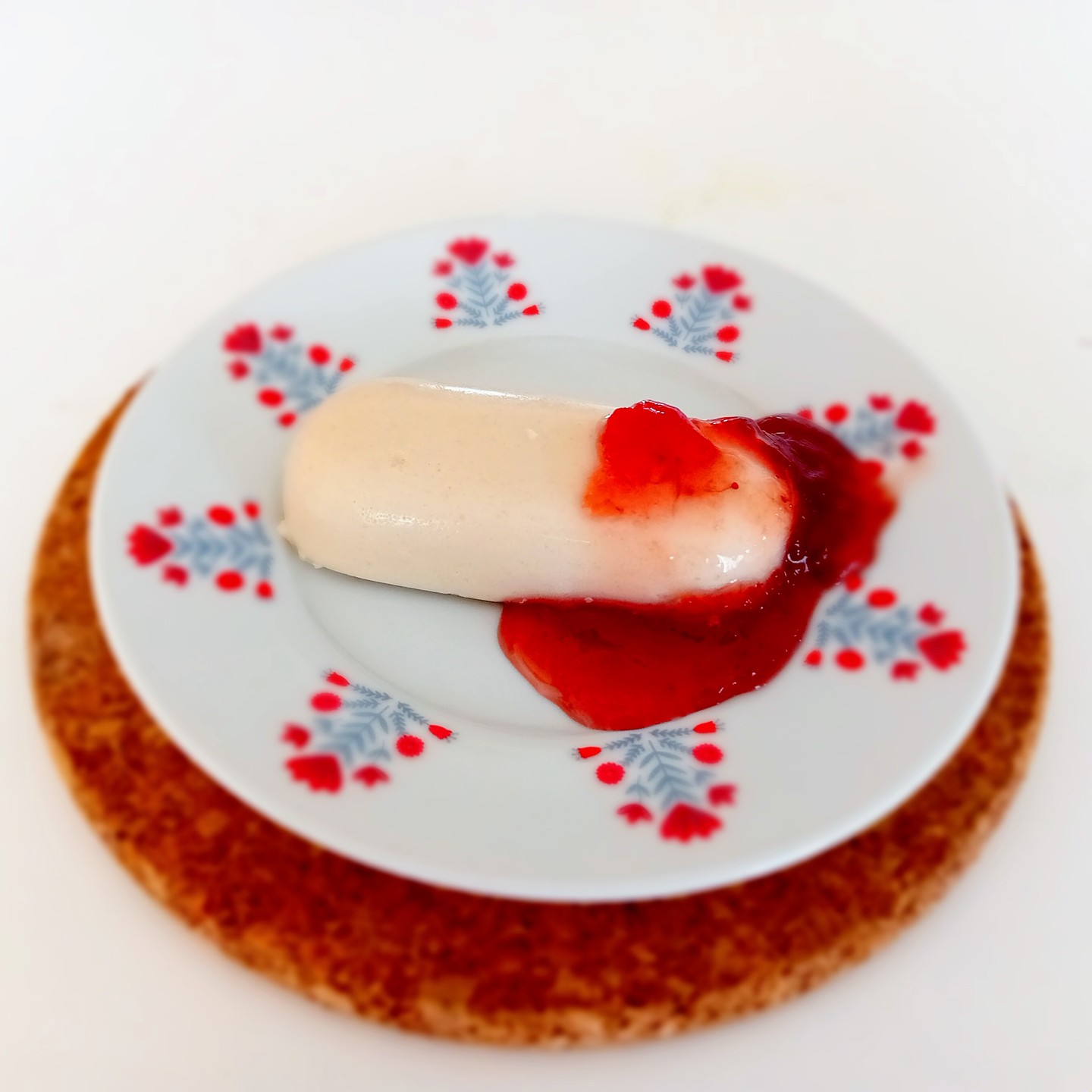Deli cotta with strawberry purée.