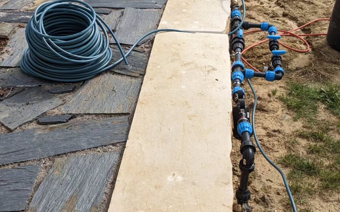 Burying tube to and through the terrace for wiring up it’s irrigation valve.