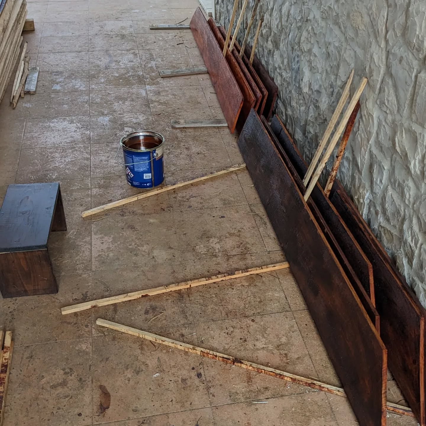 Varnishing planks for the bird coops.