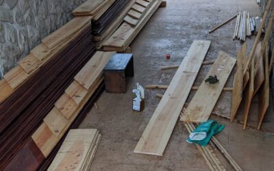 Applying linseed oil to planks for the new duck coop walls.