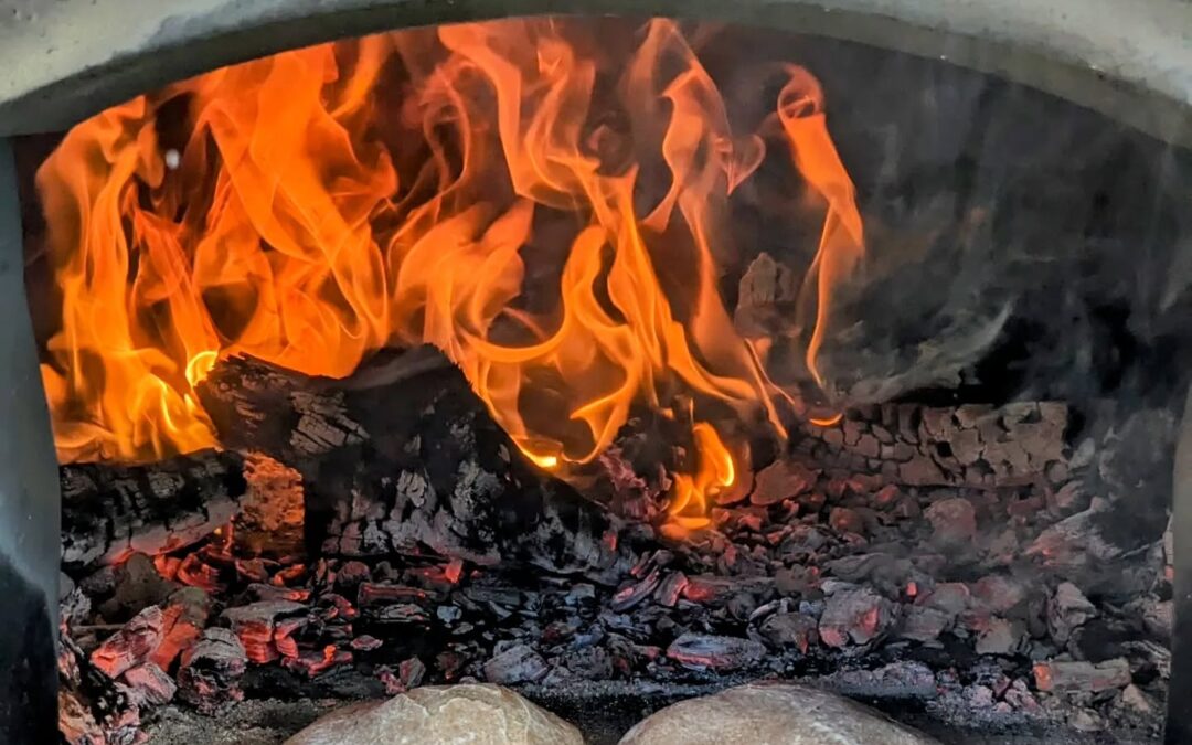 Sourdough whole grain pitas puffing up in the oven.