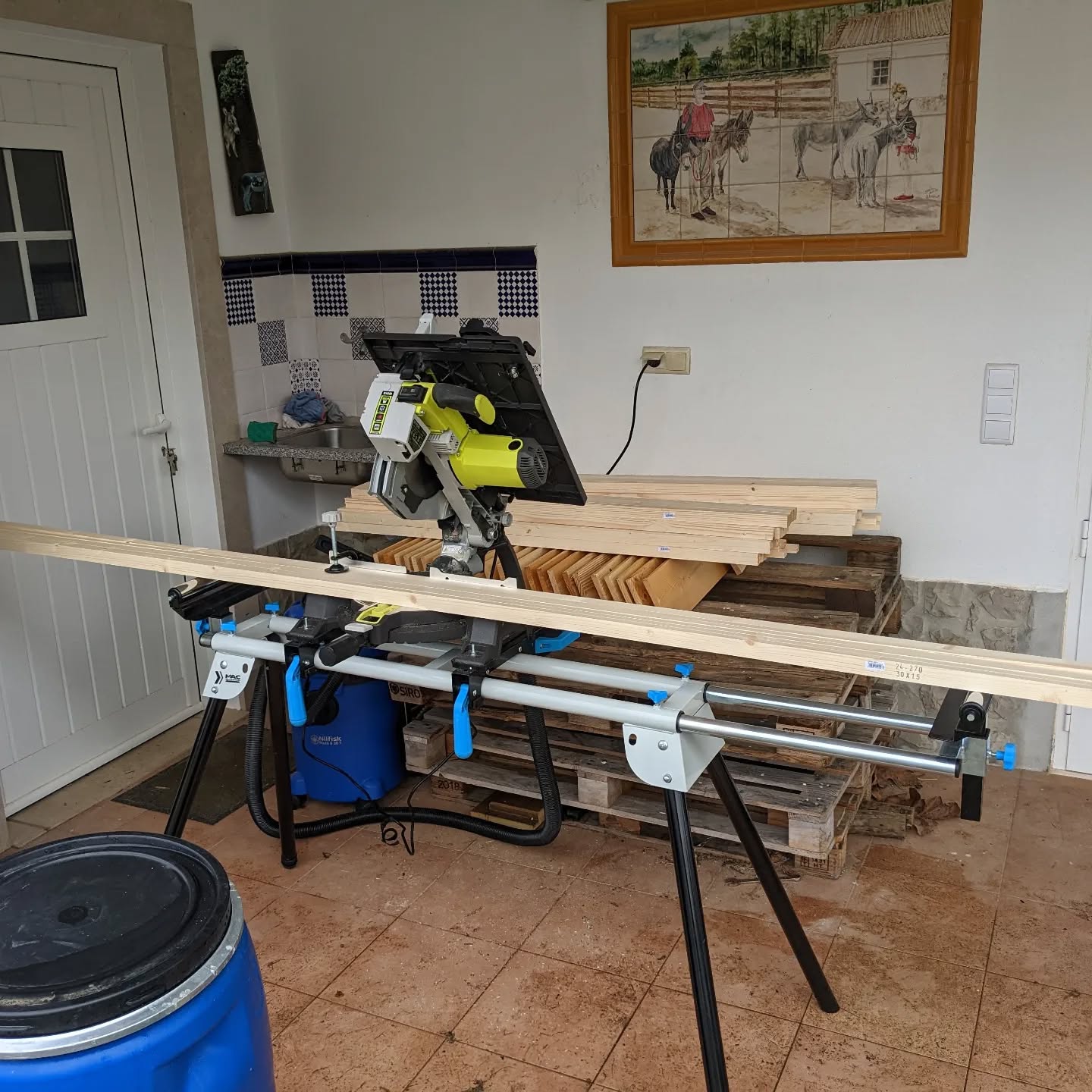 Another rainy weather project: cutting lumber for the #greenhouse cover.