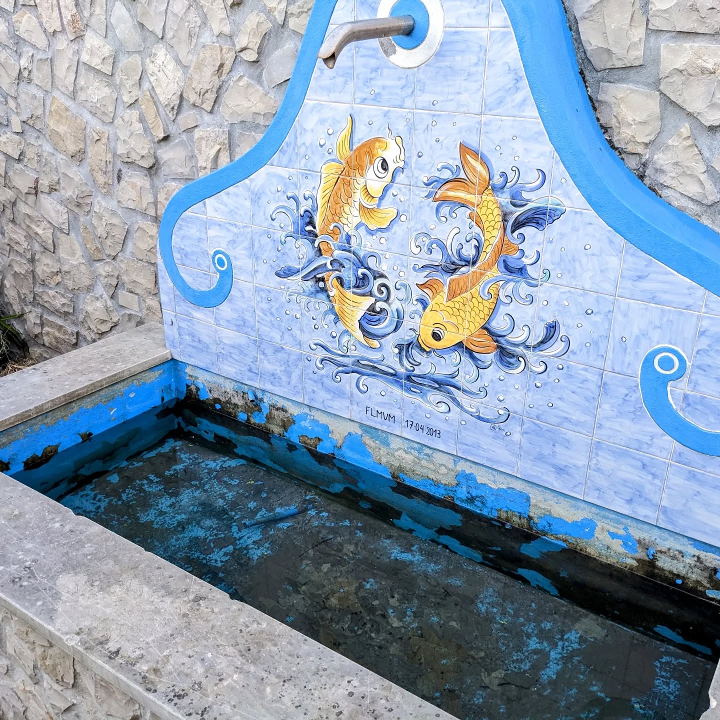 This fountain/mini pond structure was here when we moved in, likely never used. After two more years of rain and kids playing, it was full of smelly water, rocks, and debris.