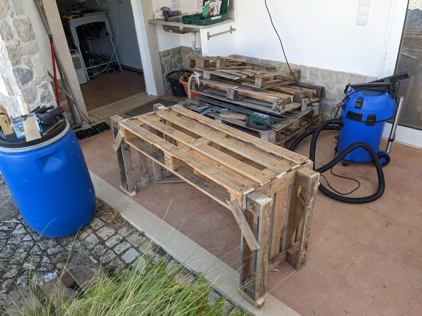 Improvised #palletwood duck shelter. They’ve been spending the nights indoors in a box, but now the storm passed and we’re considering letting them outside overnight. This should help.