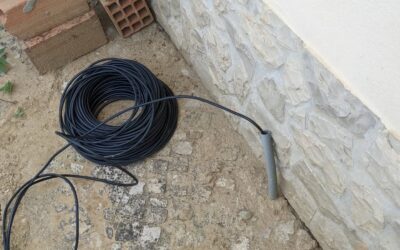 After lots of frustrating and ultimately unfruitful exploration, this seems to be the best option to run a power cable out of the churrasco to use for the irrigation controllers.