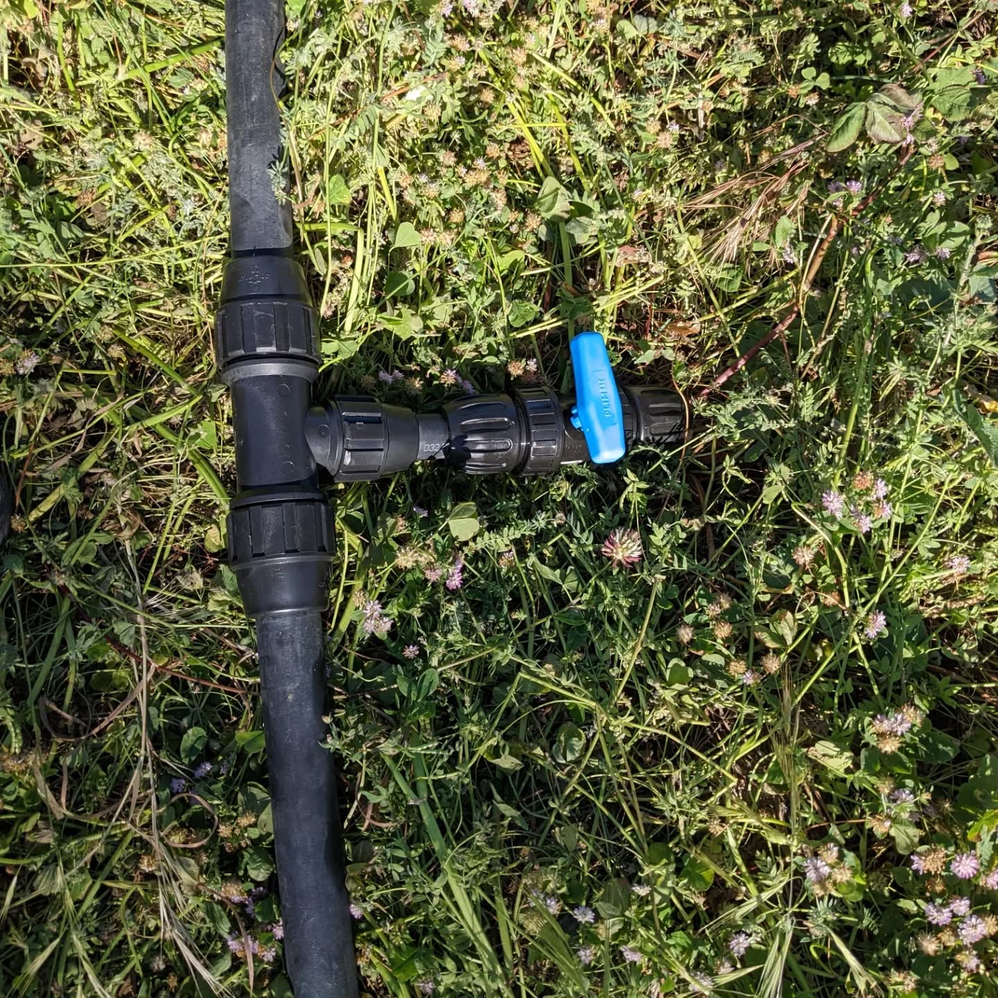 Installing a bunch of hose fittings to prepare for 2 #irrigation lines (one of them now functional on the west #swale #berm), a couple of soaker hoses, and a water point.