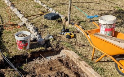 Breaking stone edging to make room for the new bed