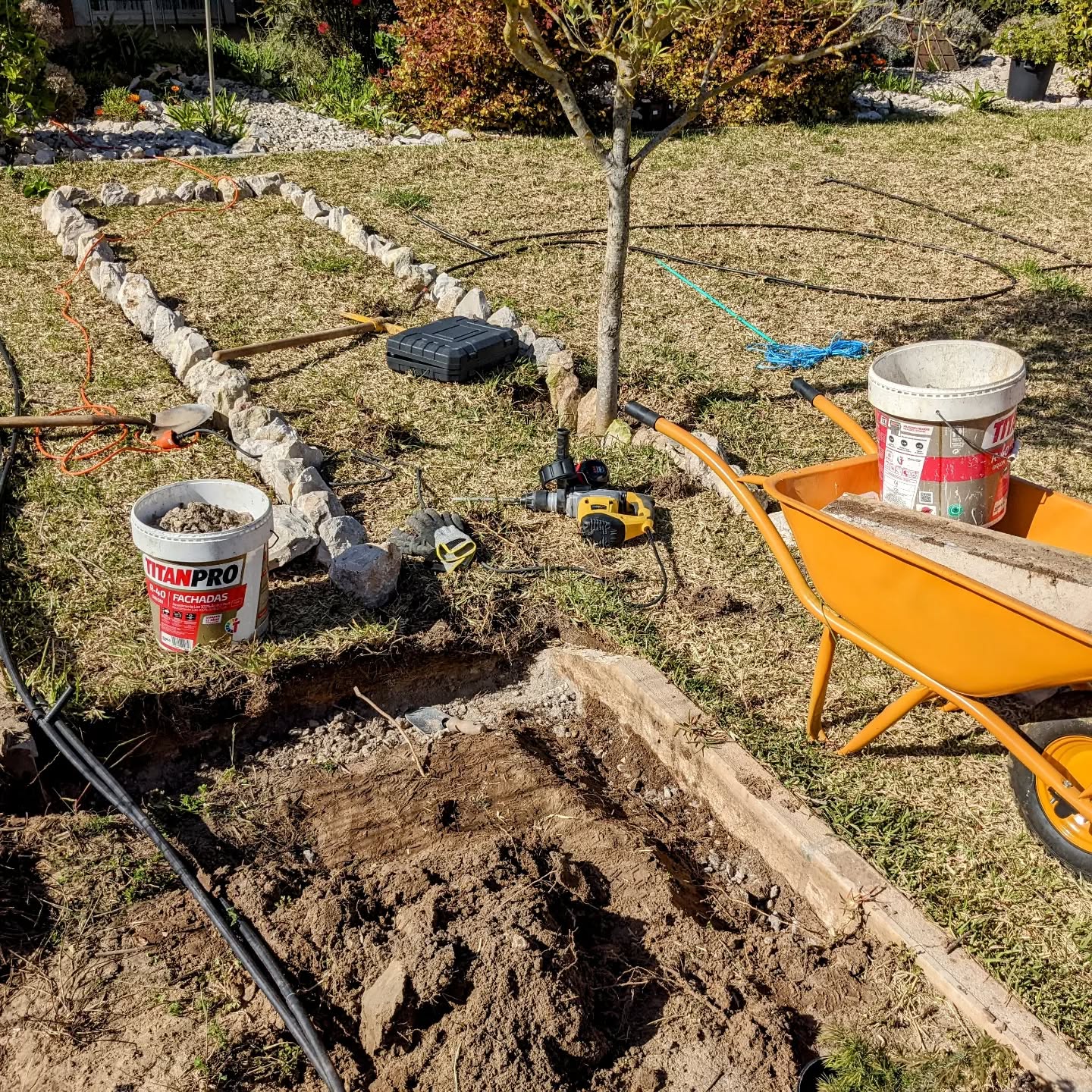 Breaking stone edging to make room for the new bed